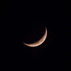 Low angle view of moon against sky at night