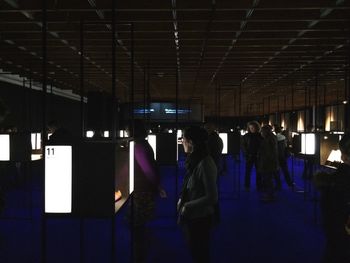 People in illuminated room