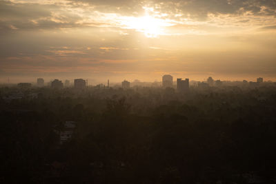 Cityscape against sky during sunset