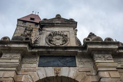 Low angle view of statue against sky