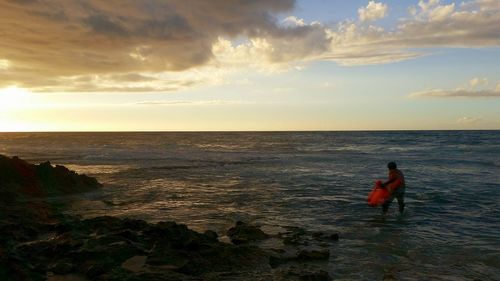 Scenic view of sea at sunset