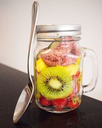 Close-up of fruits in jar on table