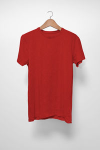 Red flag hanging against white background