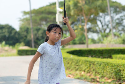 Girl playing badminton at park
