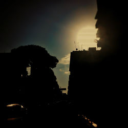 Silhouette built structure against sky