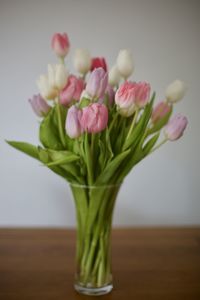 Close-up of pink flower vase on table