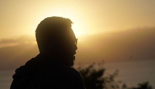 Portrait of silhouette man against sky during sunset