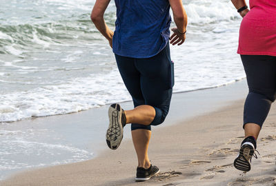 Low section of people on beach