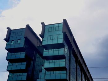 Low angle view of modern building against sky