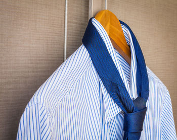 Close-up of shirt hanging on coathanger