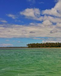 Scenic view of sea against cloudy sky