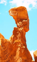 Low angle view of statue against blue sky