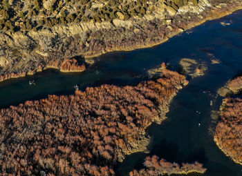 High angle view of rocks in sea