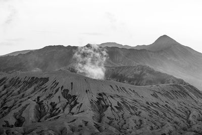 Beautiful view landscape of active volcano crater with smoke at mt. bromo, east java, indonesia.