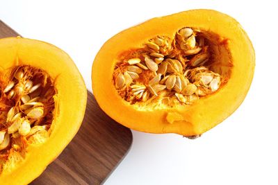 Close-up of pumpkin against orange background