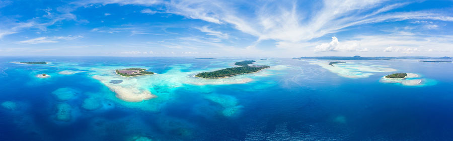 Panoramic view of sea against blue sky