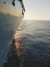 Close-up of cruise ship on sea against clear sky