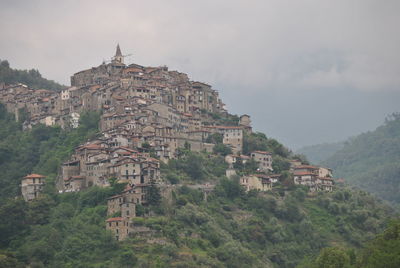 Buildings in town against sky