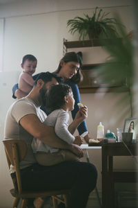 Family online consulting on video with female doctor through laptop at home