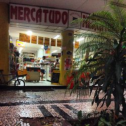 Illuminated store in city at night