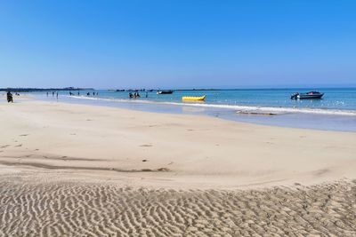 Scenic view of beach against clear sky