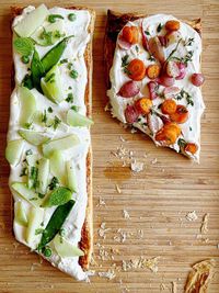 High angle view of pizza on cutting board