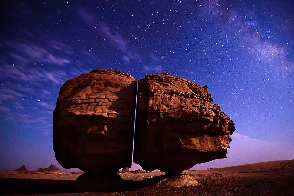 rock, star - space, rock formation, rock - object, sky, space, scenics - nature, solid, astronomy, galaxy, night, beauty in nature, star, nature, star field, tranquil scene, tranquility, no people, low angle view, geology, milky way, space and astronomy, formation, eroded