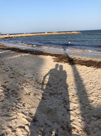 Scenic view of beach against clear sky