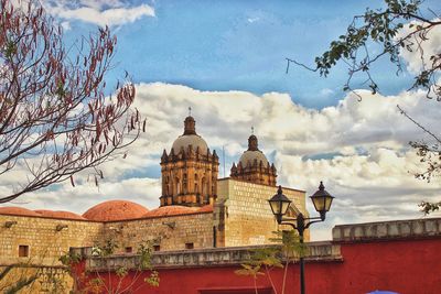 Low angle view of cathedral against cloudy sky