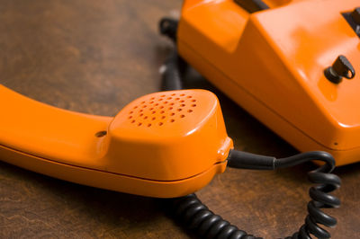 Close-up of telephone on table