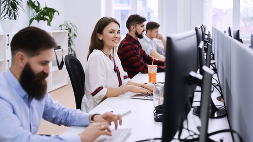 Business colleagues working in office