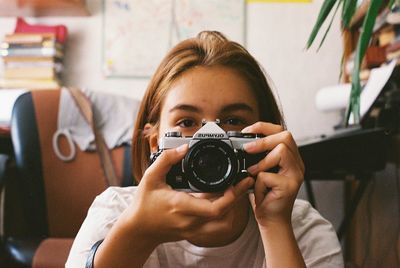 Portrait of woman photographing