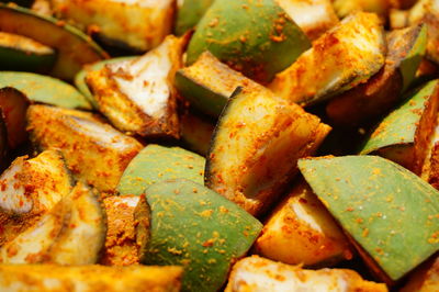 Full frame shot of mango slices mixed with spices