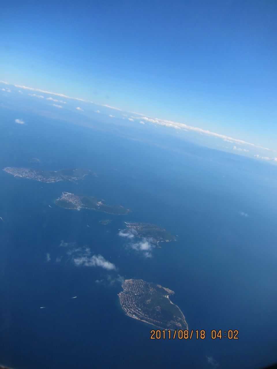 sea, blue, water, aerial view, scenics, transportation, nature, tranquil scene, copy space, beauty in nature, tranquility, high angle view, sky, horizon over water, clear sky, waterfront, ocean, mode of transport, coastline, no people