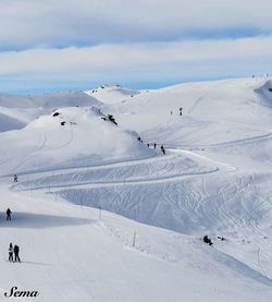 Scenic view of snow covered mountains