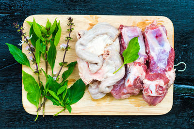 High angle view of meat on cutting board