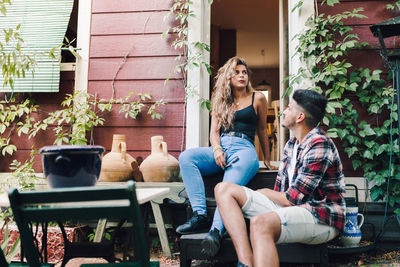 Couple sitting in flower pot