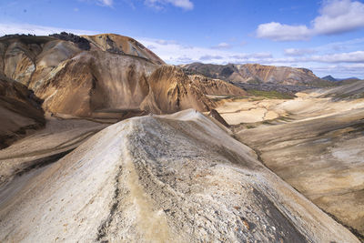 Man standing on top of hill in the highlands of iceland