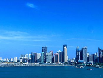 City buildings against blue sky