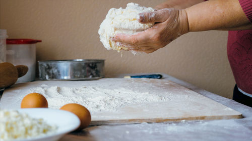 Midsection of man preparing food at home