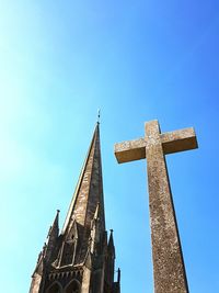 Low angle view of st martin church and cross against clear blue sky