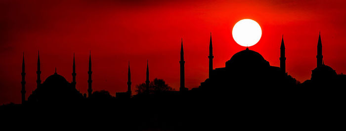 Silhouette of mosque at sunset