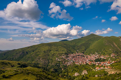 Scenic view of  mountain village against sky