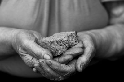 Midsection of woman holding sponge 