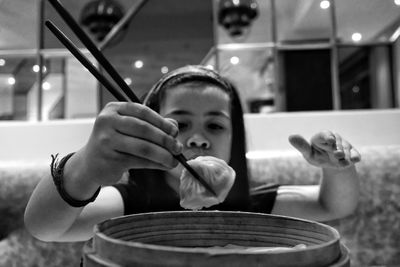 Cute girl eating food outdoors