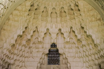 Low angle view of statue against building