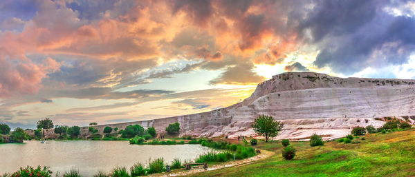 Panoramic view of lake against sky during sunset