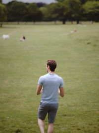 Rear view of man standing on land