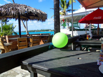 Close-up of chair on table at beach