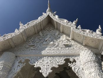 Low angle view of temple against building